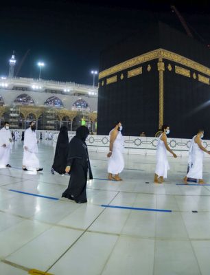 A handout picture provided by the Saudi Ministry of Hajj and Umrah on October 4, 2020, shows Saudis and foreign residents circumambulating the Kaaba (Tawaf) in the Grand Mosque complex in the holy city of Mecca, as authorities partially resume the year-round Umrah for a limited number of pilgrims amid extensive health precautions after a seven-month coronavirus hiatus. (Photo by - / Saudi Ministry of Hajj and Umra / AFP) (Photo by -/Saudi Ministry of Hajj and Umra/AFP via Getty Images)